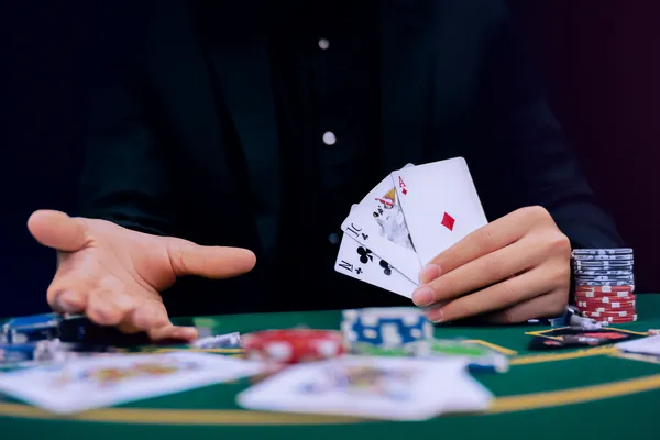 A player using their smartphone during a festive local event, representing 4777BETT’s fully mobile-friendly casino.